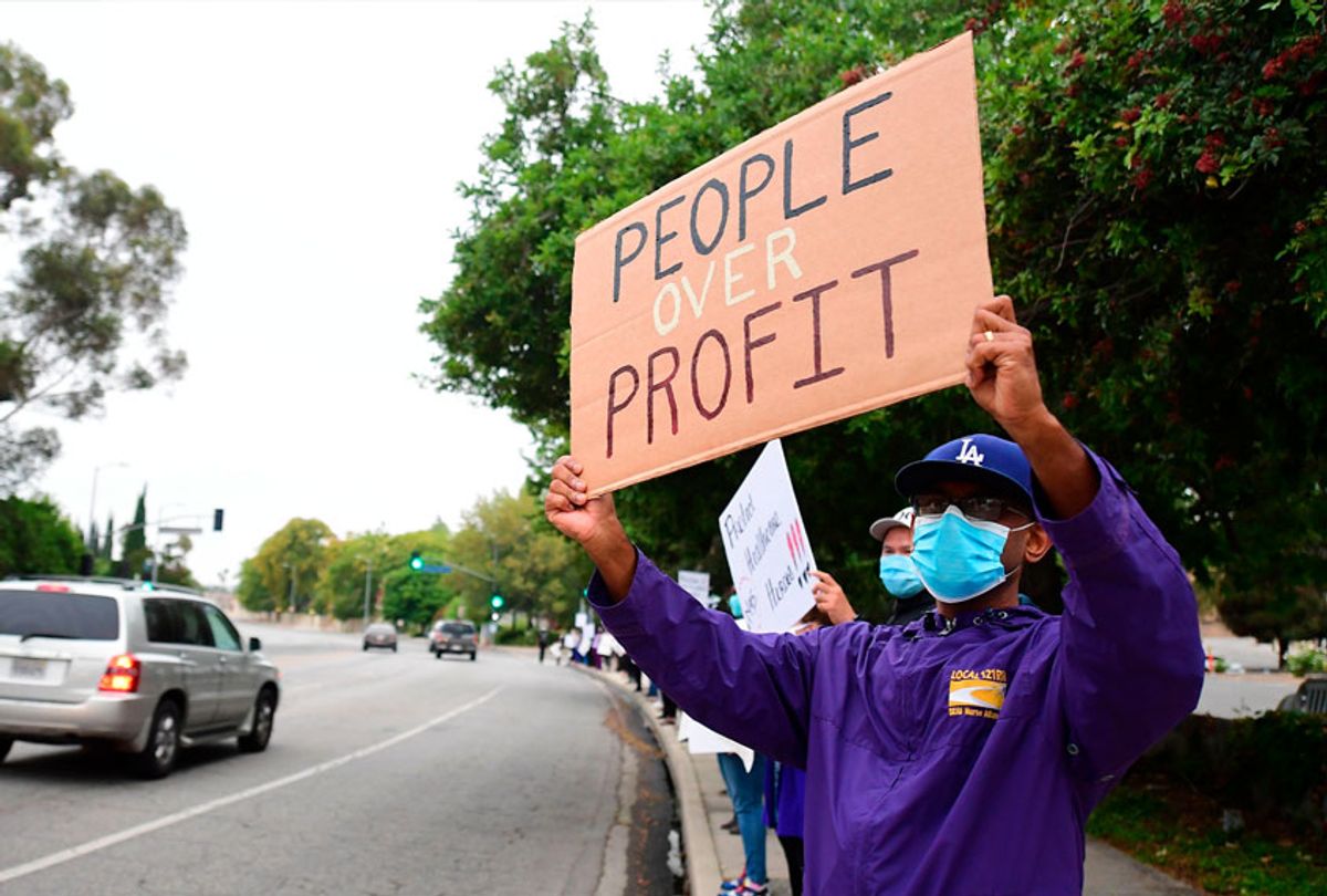 Nurses stage a protest with support from the registered nurses union, SEIU Local 121RN, outside the West Hills Hospital on June 18, 2020 in West Hills, California. (FREDERIC J. BROWN/AFP via Getty Images)